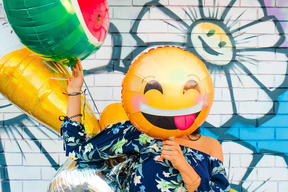 Woman behind ballons